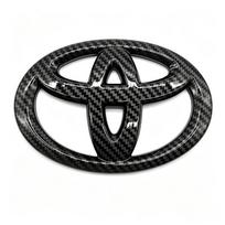 65X45mm Automobilio vairo centro emblemos logotipas Lipdukas Toyota Hilux RAV4 Aygo Yaris Ractis Corolla Camry CHR Auris Tacoma WY0 sidabras