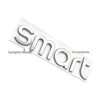 Suderinama su SMART automobilio metaliniu logotipu lipduku priekinei, galinei daliai ir variklio dangčiui.