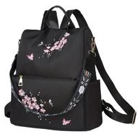 Neutral style backpack for men and women, suitable for daily travel and outings. Features a rear zipper with printed design. black
