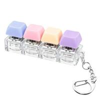 Klaviatūros Fidget žaislas 4-in-1 Klaviatūros dekompresijos mygtukas Pirštų spragsėjimo žaislas 4 klavišų Fidget raktų pakabukas Darbui Kelionėms Streso mažinimo stalo žaislas white