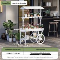 Didelis masyvmedžio pastoralinis gėlių stovas-vežimėlis: Kūrybingas prekybos centro vitrinos ir lauko dekoracijų stovas Small Wheeled Flower Box dramblio kaulas