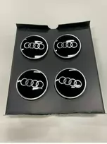 VAG "Audi Dynamic" besisukantis centrinis stebulės dangtelis juodas originalus 4M8071006A