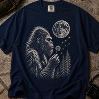 Bigfoot Blowing Dandelion Shirt, Moonlit Sasquatch Tee, Woodland Cryptid Apparel 3XL black