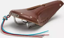 Brooks Balnelis BROOKS B17 CARVED, rudos spalvos, plieniniai lankeliai, svoris 520 g, linija Leather
