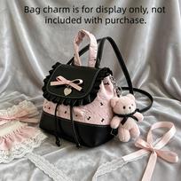This women's backpack features a sweet and alluring pink and black color scheme with a ruffled bow, perfect for daily commutes and weekend trips. The bag hanger is for dis rožinė