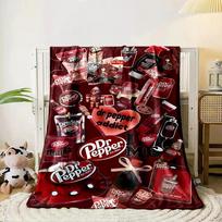 A collage of Dr Pepper-themed products and branding on a dark red background. for all seasons blanket lunch break throw gift 80cm x 120cm black