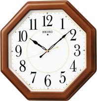 Seiko Radijo bangomis valdomas aštuonkampis sieninis laikrodis - Rudo medžio apdailos serija, modelis KX389B, Apytiksl.. 33x33 cm ruda