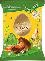 "Lindt" šokoladiniai veganiški lazdyno riešutų kiaušiniai, 90 g maišelis, kakavos gaminys iš avižinių dribsnių, užpildytas lazdyno riešutų kremu, velykinis šokoladas, velykiniai kiaušiniai, veganiški šokoladiniai kiaušiniai
