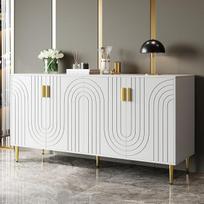 Balta komoda (152 x 40 x 75 cm) su unikaliu banguotu dizainu bei auksinėmis rankenėlėmis ir kojelėmis, kuri suteiks elegancijos jūsų valgomojo zonai