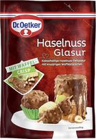 „Dr. Oetker“ lazdyno riešutų glazūra – su traškiais vaflių gabalėliais, švelniai tirpstanti, kakavos turinti lazdyno riešutų glazūra suteikia papildomą traškumo dozę pyragams, tortams ir desertams.