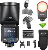 „Godox V1 mid C“ (V1midC) TTL blykstė, skirta „Canon Mini Flash“, su jutikliniu ekranu, apvaliu blykstės gaubtu, įkrovimo trukmė – 1,7 s, maždaug 650 blyksnių esant maksimaliam galingumui, 2 W LED apšvietimas, 1/8000 s HSS
