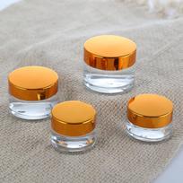 50 g kremo indelis, 100 ml kosmetinis stiklinis buteliukas, 30 ml paakių kremo talpyklė. orange