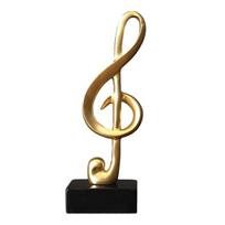 Muzikos natos skulptūra Auksinė derva Muzikinis simbolis Figūrėlė Modernus stalo dekoras Pianino kambariui Namų biuro stalo centrinė dalis A brown