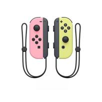 Rožinis/geltonas „Joy-Con“ valdiklis (K/D), pridedami dirželiai