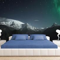 Fototapetas Artgeist Northern Lights - Snowy Mountain Landscape in Winter Night with Cosmos in the Background SNEW010415, 70 cm x 100 cm